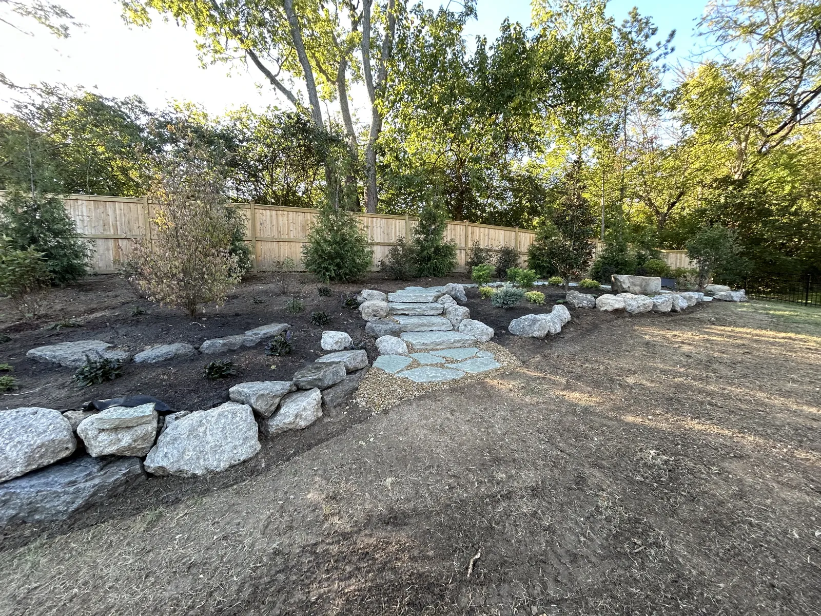 Stone steps set into a boulder garden wall