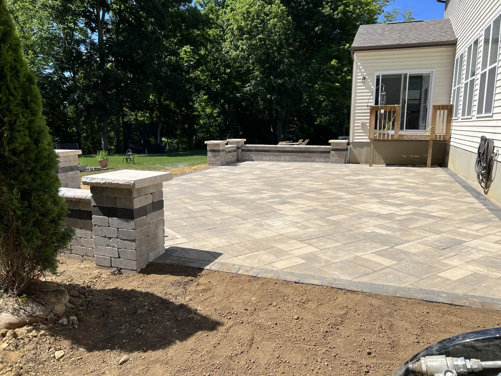 Paver patio with seat wall and capped columns