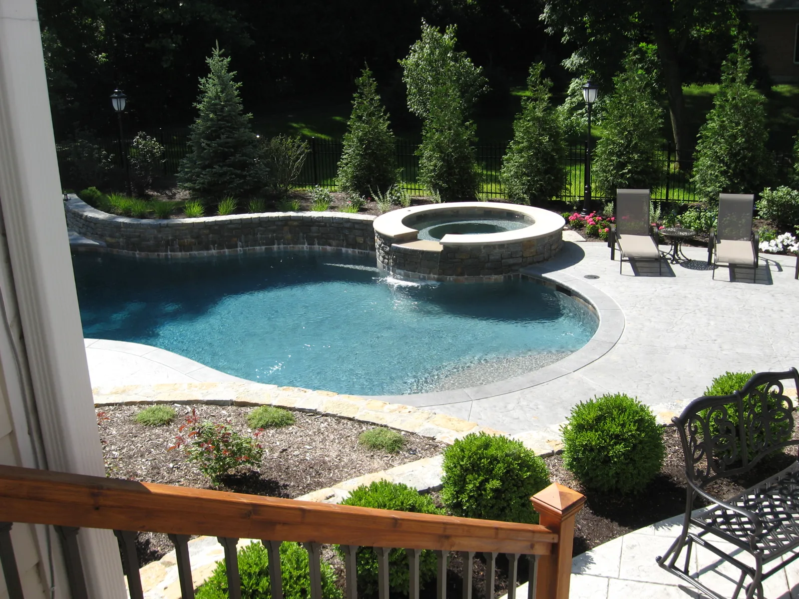 Freeform pool and spa viewed from the deck above