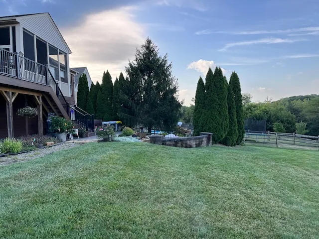 Open lawn and deck before the landscape installation