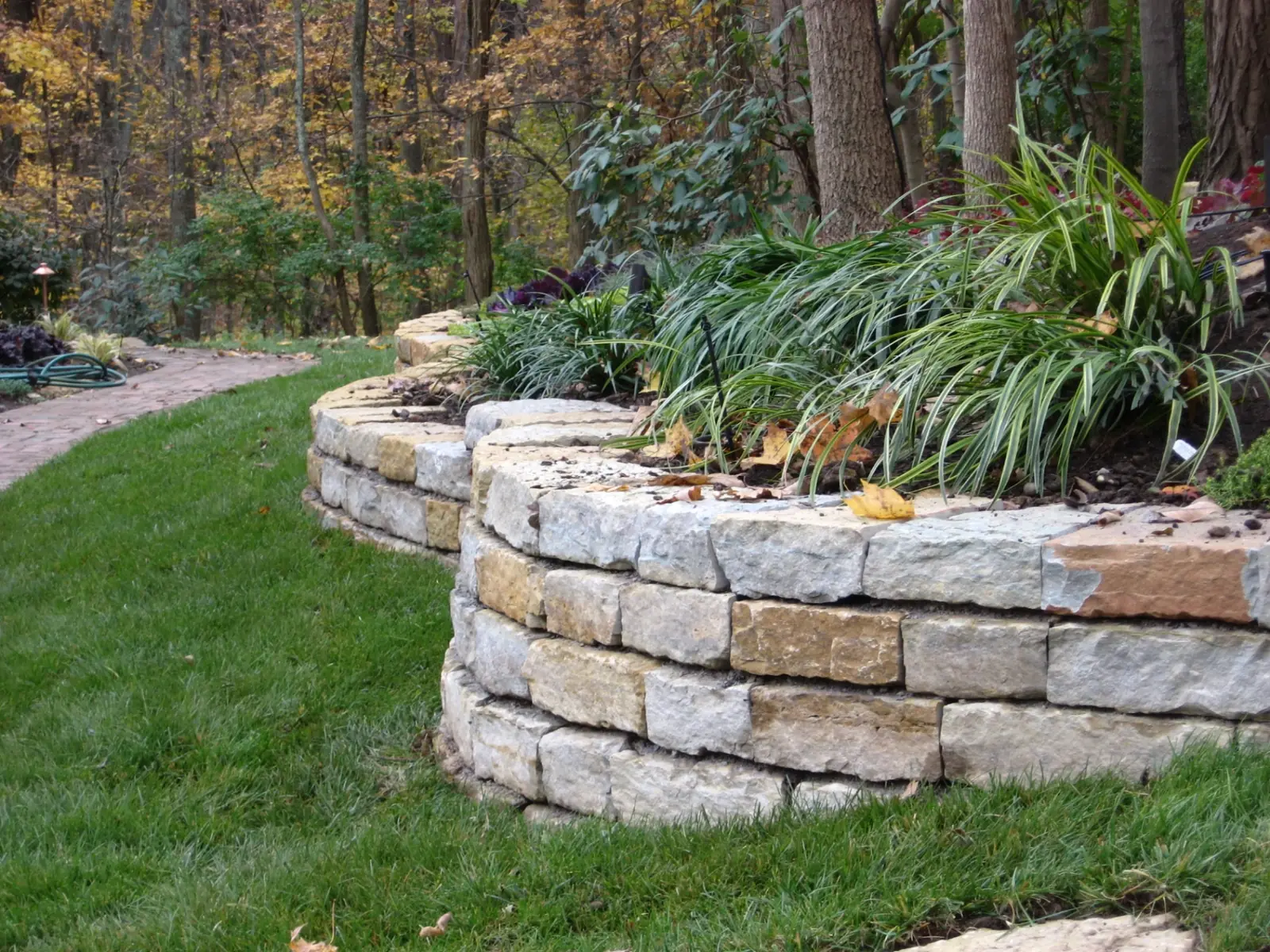 Hand-built natural stacked stone retaining wall