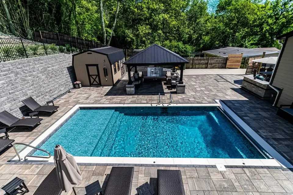 Custom pool and pavilion forming a complete backyard entertaining space